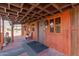 Welcoming porch with wooden beams, cozy seating, and a view of the yard at 29972 N Bryce Trl, San Tan Valley, AZ 85144