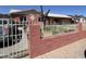 Charming home featuring well-maintained landscaping, decorative architectural details, and a fenced yard at 3020 N 64Th Dr, Phoenix, AZ 85033