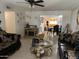 The Living room offers comfortable couches with gold accents, tiled flooring and gold decorative mirrors at 3020 N 64Th Dr, Phoenix, AZ 85033