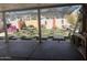 Patio featuring checkered artificial grass, comfortable seating, and shaded space at 3020 N 64Th Dr, Phoenix, AZ 85033
