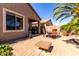 Spacious backyard with an outdoor grill, patio set, and lush green surroundings offers ample space at 37852 W Merced St, Maricopa, AZ 85138