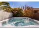 A tranquil spa is nestled amid vibrant plants, providing a calming retreat for relaxation at 37852 W Merced St, Maricopa, AZ 85138