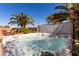 Inviting backyard hot tub surrounded by lush greenery, offering a private and serene relaxation space at 37852 W Merced St, Maricopa, AZ 85138