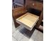Oak kitchen cabinet features a convenient sliding wood drawer for organized storage solutions at 37852 W Merced St, Maricopa, AZ 85138