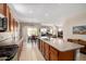 Open-concept kitchen flows into dining and living areas, perfect for entertaining guests and Gathering at 37852 W Merced St, Maricopa, AZ 85138