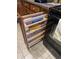 A pull-out storage rack provides a place for wraps and other cooking supplies next to the oven at 37852 W Merced St, Maricopa, AZ 85138
