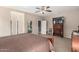 Comfortable primary bedroom with neutral tones and ample closet space at 37852 W Merced St, Maricopa, AZ 85138