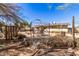 Backyard featuring a patio area with a metal pergola and outdoor furniture at 411 N 111Th Pl, Mesa, AZ 85207