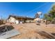 Backyard featuring a portable basketball goal, fence and detached garage at 411 N 111Th Pl, Mesa, AZ 85207