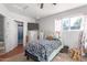 Bedroom with a ceiling fan, carpet flooring, and natural light at 411 N 111Th Pl, Mesa, AZ 85207