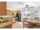 Cozy eat in kitchen with ceiling fan, tile flooring, and ample countertop space at 411 N 111Th Pl, Mesa, AZ 85207