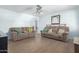 Bright and open living room with tile flooring and neutral paint at 411 N 111Th Pl, Mesa, AZ 85207