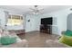 Bright living room featuring tile floors, neutral paint, and comfortable seating at 411 N 111Th Pl, Mesa, AZ 85207