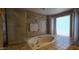 Beautiful bathroom suite offers tile flooring, a walk in shower, and separate bathtub at 4242 W Sandra Ter, Phoenix, AZ 85053