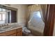 Tiled bathroom with a tub shower combination featuring a toilet and single vanity at 4242 W Sandra Ter, Phoenix, AZ 85053