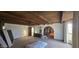 Spacious bedroom features wood-beamed ceilings, archways, and lots of natural light at 4242 W Sandra Ter, Phoenix, AZ 85053