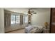 Bedroom with a ceiling fan and two large windows providing lots of natural light at 4242 W Sandra Ter, Phoenix, AZ 85053
