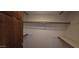 This walk-in closet features multiple shelves providing ample storage options at 4242 W Sandra Ter, Phoenix, AZ 85053