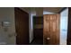This entryway features wood paneled doors, neutral colored walls and unique tile flooring at 4242 W Sandra Ter, Phoenix, AZ 85053