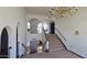 Foyer with staircase featuring a chandelier, leading to the upper level at 4242 W Sandra Ter, Phoenix, AZ 85053
