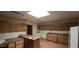 The kitchen has tile flooring, wood cabinets and an island counter at 4242 W Sandra Ter, Phoenix, AZ 85053