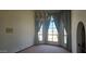 Well lit sitting room with many windows and chandelier at 4242 W Sandra Ter, Phoenix, AZ 85053