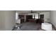 Open-concept living room connecting to kitchen, offering versatile layout possibilities at 4242 W Sandra Ter, Phoenix, AZ 85053