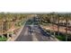Stunning aerial view showcases the community's well-maintained roads, lush landscaping, and inviting atmosphere at 42430 W Oakland Dr, Maricopa, AZ 85138