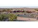 Aerial view displays the well-maintained school with ample parking and surrounding desert landscape at 42430 W Oakland Dr, Maricopa, AZ 85138