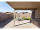 Lovely covered patio with outdoor seating, providing an inviting space for relaxation and entertaining at 42430 W Oakland Dr, Maricopa, AZ 85138
