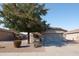 Charming single-story home with desert landscaping and a mature shade tree in the front yard at 42430 W Oakland Dr, Maricopa, AZ 85138