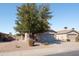 Inviting single-story house featuring a two-car garage and low-maintenance desert landscaping at 42430 W Oakland Dr, Maricopa, AZ 85138