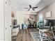Bright home office space with modern desk setup and a Peloton exercise bike at 42430 W Oakland Dr, Maricopa, AZ 85138