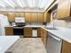 Functional kitchen featuring wood cabinets, modern appliances, and ample counter space at 425 S Parkcrest -- # 335, Mesa, AZ 85206