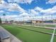 Community lawn bowling area featuring green turf lanes and shaded seating at 425 S Parkcrest -- # 335, Mesa, AZ 85206