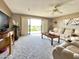 Inviting living room with a ceiling fan, balcony access, and ample seating at 425 S Parkcrest -- # 335, Mesa, AZ 85206
