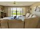 Bright living room featuring a large sliding glass door to balcony and comfortable seating at 425 S Parkcrest -- # 335, Mesa, AZ 85206