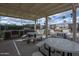 Spacious outdoor kitchen area with grill, sink and seating under a covered patio, perfect for entertaining at 425 S Parkcrest -- # 335, Mesa, AZ 85206