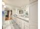 Bright bathroom with a double sink vanity, granite countertops, and ample storage space at 4303 E Cactus S Rd # 229, Phoenix, AZ 85032