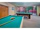 Game room with multiple pool tables, large windows, and a view of the building at 4303 E Cactus S Rd # 229, Phoenix, AZ 85032