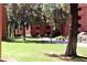 Expansive grassy area with mature trees and landscaping at 4303 E Cactus S Rd # 229, Phoenix, AZ 85032