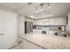 Spacious kitchen with granite countertops, white cabinets, and stainless steel appliances at 4303 E Cactus S Rd # 229, Phoenix, AZ 85032