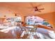Shaded pool area with outdoor seating, ceiling fans, fireplace and view of waterfall feature at 4303 E Cactus S Rd # 229, Phoenix, AZ 85032