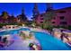Resort-style pool area with rock features and lush landscaping at 4303 E Cactus S Rd # 229, Phoenix, AZ 85032