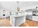 Elegant kitchen featuring a large island, stainless steel appliances, and ample counter space, perfect for cooking and entertaining at 4420 N 47Th Pl, Phoenix, AZ 85018