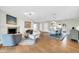 Open-concept living space combining living and dining areas with hardwood floors and modern decor at 4420 N 47Th Pl, Phoenix, AZ 85018