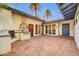 Charming outdoor patio with a brick surface, featuring a built-in grill and cozy ambiance for entertaining guests at 4420 N 47Th Pl, Phoenix, AZ 85018