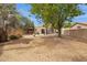 Extensive backyard features desert landscaping and mature shade trees at 5 W Ranch Rd, Tempe, AZ 85284