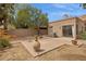 Private backyard features a brick patio and low-maintenance desert landscaping at 5 W Ranch Rd, Tempe, AZ 85284