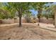 Spacious backyard featuring desert landscaping and mature shade trees at 5 W Ranch Rd, Tempe, AZ 85284